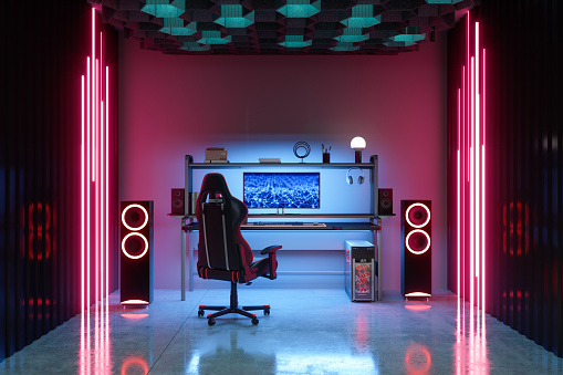 Gaming Room At Night With Neon Light. Gaming Chair And Speakers In The Room.
